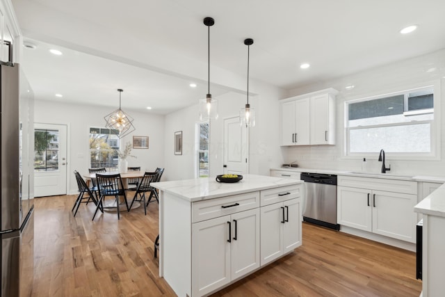 86 W N Broadway, Columbus, OH 43214 - kitchen with appliances with stainless steel finishes, plenty of natural light, light wood-type flooring, and recessed lighting