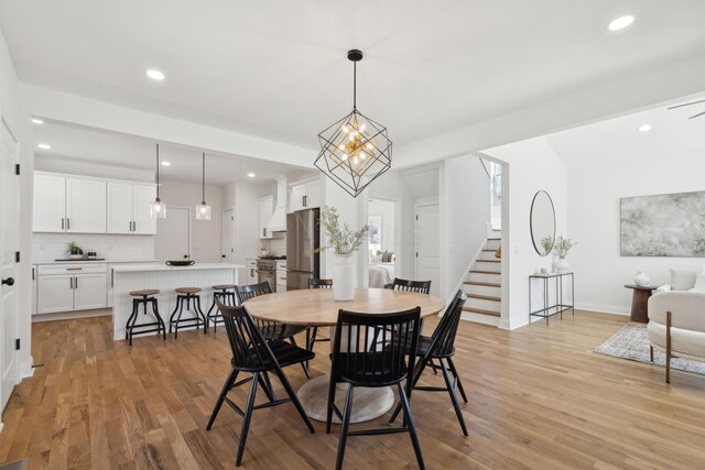 86 W N Broadway, Columbus, OH 43214 - dining room with stairs, light wood finished floors, and recessed lighting