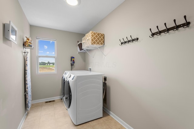 6750 Constitution Way, Powell, OH 43065 - laundry area with separate washer and dryer and baseboards