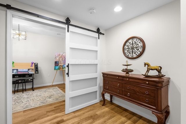 6750 Constitution Way, Powell, OH 43065 - detailed view of a barn door, a smoke detector, wood finished floors, and recessed lighting