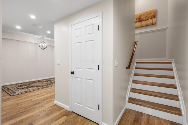 6750 Constitution Way, Powell, OH 43065 - staircase featuring hardwood / wood-style flooring, recessed lighting, and a chandelier