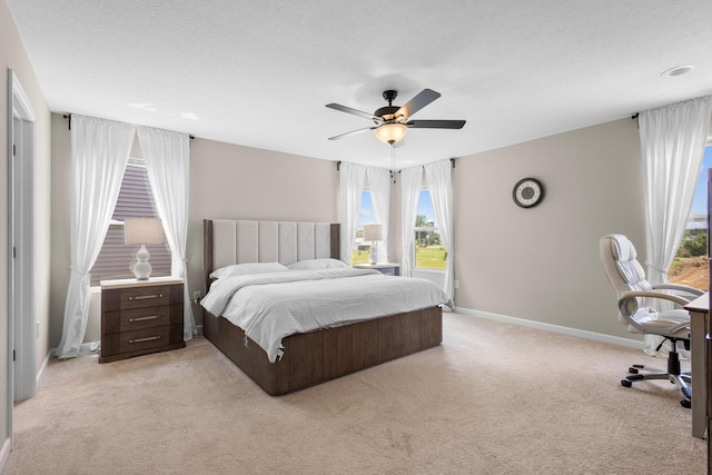 6750 Constitution Way, Powell, OH 43065 - bedroom with light colored carpet, multiple windows, and ceiling fan