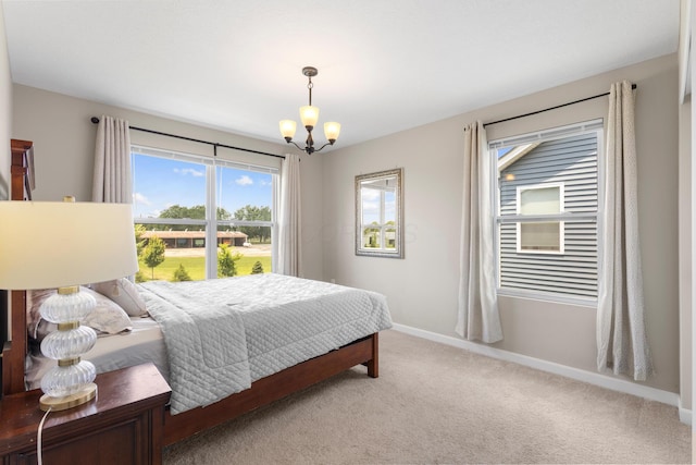 6750 Constitution Way, Powell, OH 43065 - bedroom featuring a chandelier and light carpet