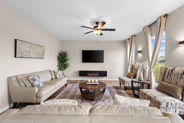 6750 Constitution Way, Powell, OH 43065 - living area with a ceiling fan, wood finished floors, and a glass covered fireplace