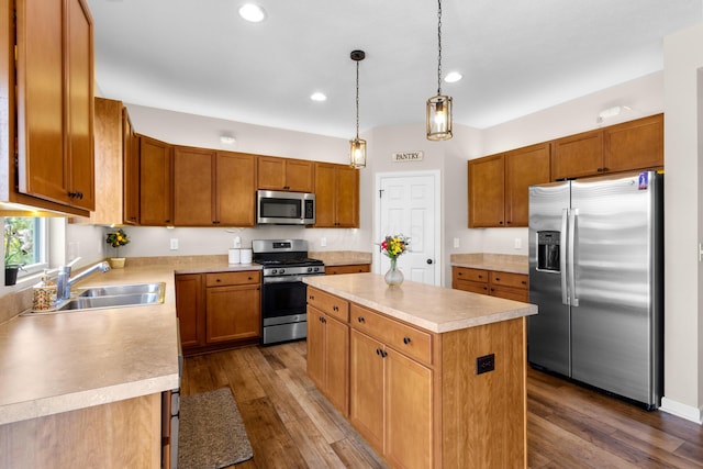 6750 Constitution Way, Powell, OH 43065 - kitchen with appliances with stainless steel finishes, light countertops, a kitchen island, recessed lighting, and dark wood finished floors