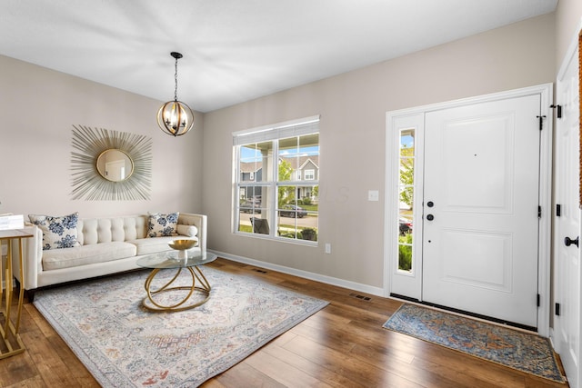 6750 Constitution Way, Powell, OH 43065 - entrance foyer with wood finished floors and a chandelier