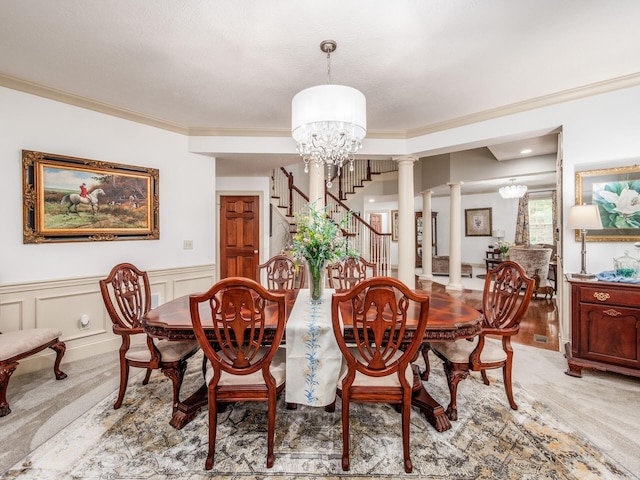 6676 Ballantrae Pl, Dublin, OH 43016 - dining area with a chandelier, decorative columns, stairway, light colored carpet, and ornamental molding