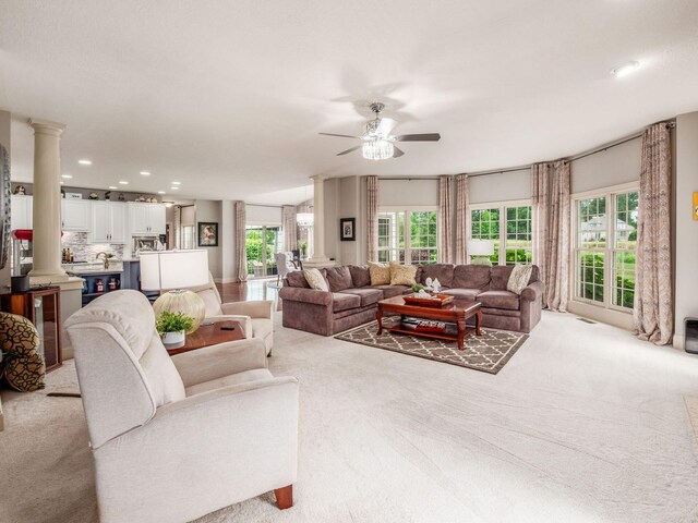 6676 Ballantrae Pl, Dublin, OH 43016 - living room featuring ceiling fan, light colored carpet, ornate columns, and recessed lighting