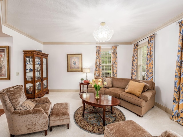 6676 Ballantrae Pl, Dublin, OH 43016 - carpeted living area featuring crown molding and a chandelier