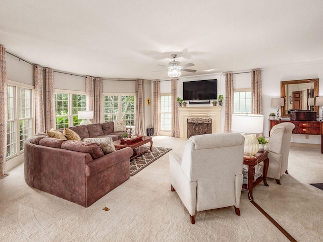 6676 Ballantrae Pl, Dublin, OH 43016 - living room featuring light colored carpet, ceiling fan, and a fireplace