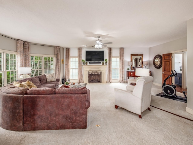 6676 Ballantrae Pl, Dublin, OH 43016 - living area with carpet, a ceiling fan, and a fireplace