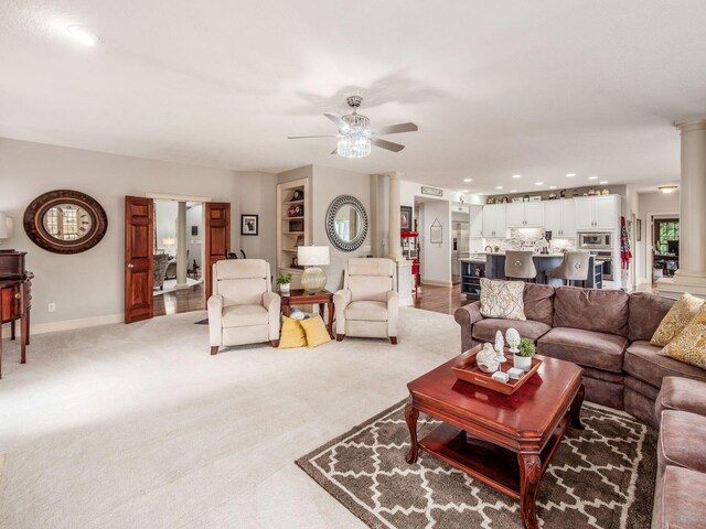 6676 Ballantrae Pl, Dublin, OH 43016 - living room with ceiling fan, decorative columns, recessed lighting, and light carpet