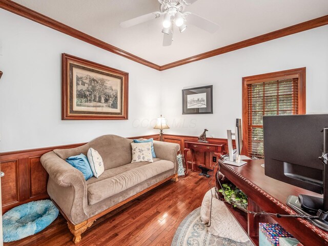 6676 Ballantrae Pl, Dublin, OH 43016 - living room featuring ornamental molding, a ceiling fan, wood finished floors, and wainscoting