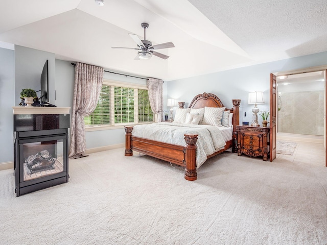 6676 Ballantrae Pl, Dublin, OH 43016 - bedroom with lofted ceiling, carpet, ceiling fan, a multi sided fireplace, and connected bathroom