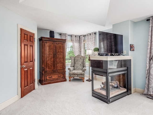 6676 Ballantrae Pl, Dublin, OH 43016 - sitting room with carpet and a multi sided fireplace