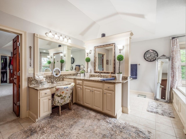 6676 Ballantrae Pl, Dublin, OH 43016 - full bathroom featuring lofted ceiling, vanity, and tile patterned flooring