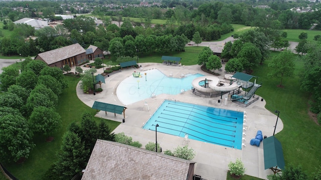 6676 Ballantrae Pl, Dublin, OH 43016 - drone / aerial view of a pool and a tree filled landscape