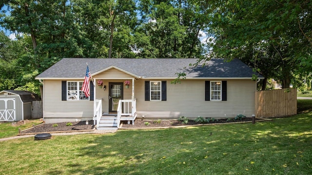 13376 Maple Rd NE, Thornville, OH 43076 - view of front of home featuring a storage shed and roof with shingles