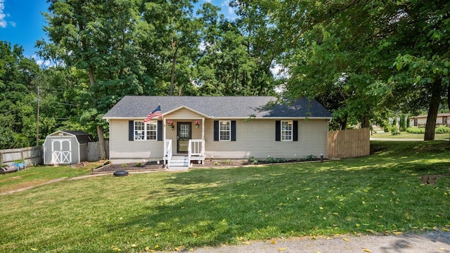 13376 Maple Rd NE, Thornville, OH 43076 - view of front of house featuring a storage unit and a shingled roof