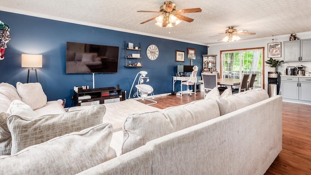 13376 Maple Rd NE, Thornville, OH 43076 - living room with wood finished floors, ceiling fan, ornamental molding, and a textured ceiling