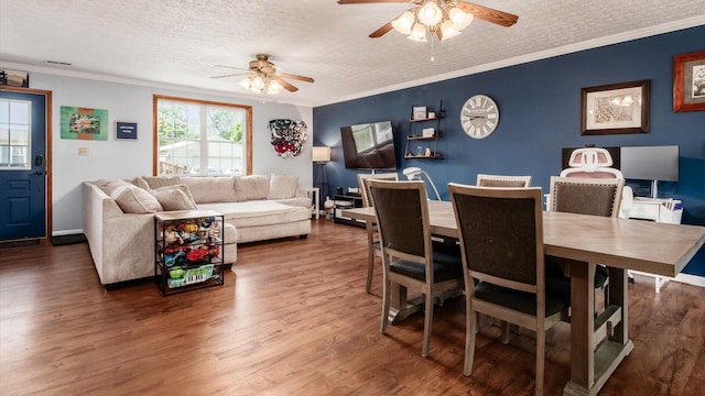 13376 Maple Rd NE, Thornville, OH 43076 - dining area with a ceiling fan, a textured ceiling, wood finished floors, and ornamental molding