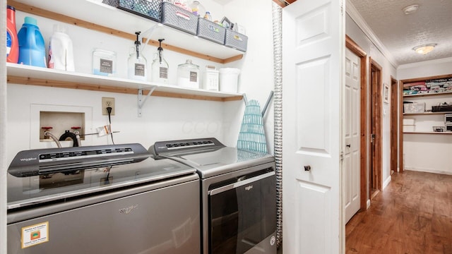 13376 Maple Rd NE, Thornville, OH 43076 - washroom with washing machine and clothes dryer, wood finished floors, ornamental molding, and a textured ceiling