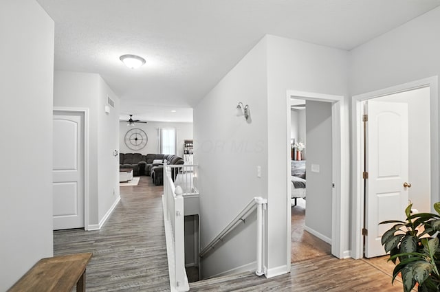 172 Rosewood Loop SE, Commercial Point, OH 43116 - hall featuring wood finished floors and an upstairs landing