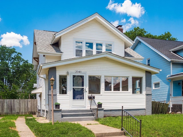 2040 Fairmont Ave, Columbus, OH 43223 - view of front of home with a shingled roof and a chimney