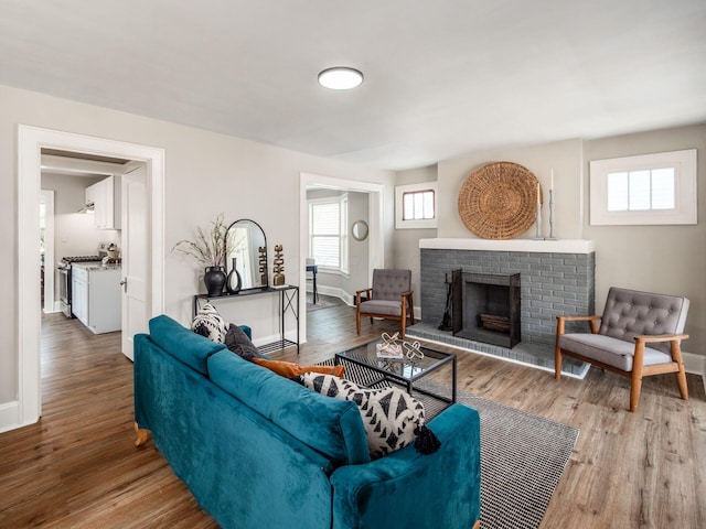2040 Fairmont Ave, Columbus, OH 43223 - living area with a brick fireplace and wood finished floors