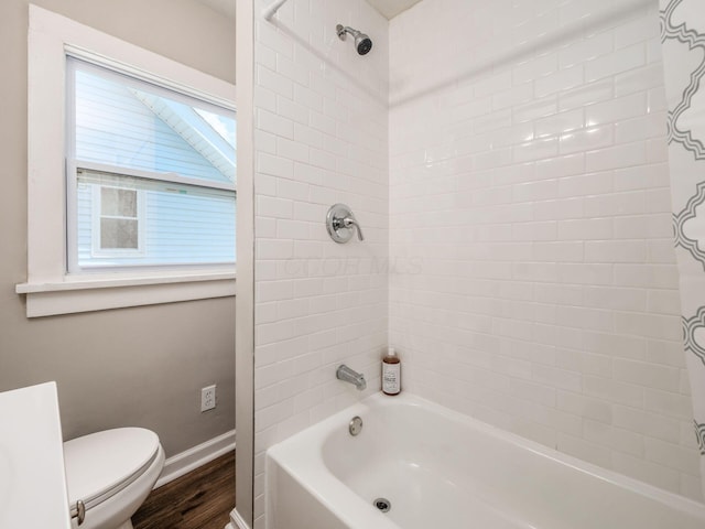 2040 Fairmont Ave, Columbus, OH 43223 - bathroom featuring shower / tub combo with curtain and wood finished floors