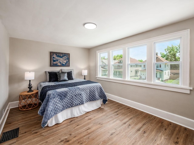 2040 Fairmont Ave, Columbus, OH 43223 - bedroom featuring wood finished floors and multiple windows