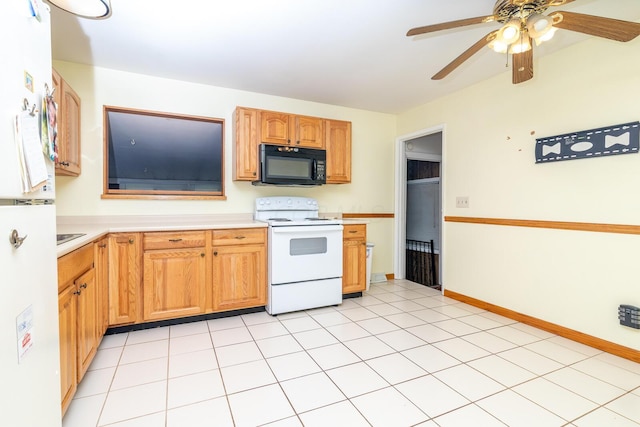 5375 Fullerton Dr, Columbus, OH 43232 - kitchen featuring white appliances, light countertops, and ceiling fan