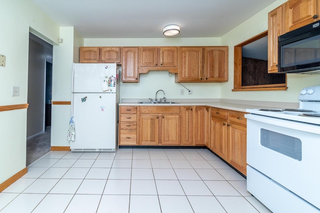5375 Fullerton Dr, Columbus, OH 43232 - kitchen featuring white appliances, light countertops, and brown cabinetry