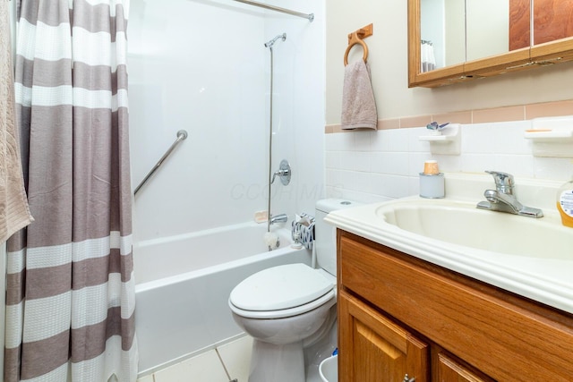 5375 Fullerton Dr, Columbus, OH 43232 - full bath featuring vanity, shower / bathtub combination with curtain, tile patterned flooring, and tile walls