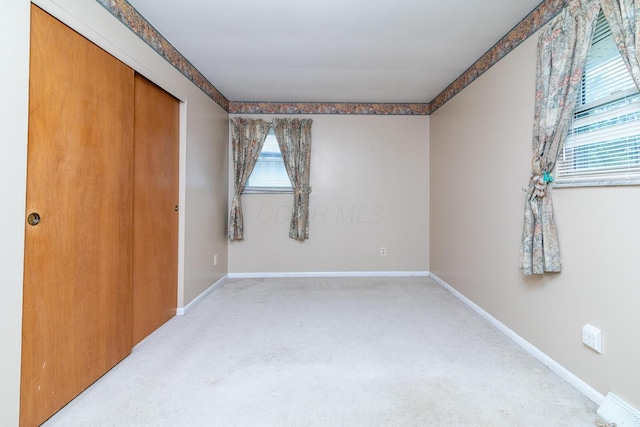 5375 Fullerton Dr, Columbus, OH 43232 - unfurnished bedroom featuring light carpet and a closet