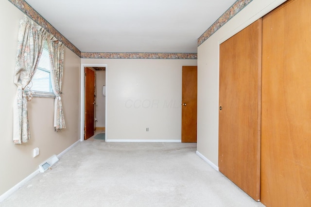 5375 Fullerton Dr, Columbus, OH 43232 - unfurnished bedroom featuring light carpet and a closet