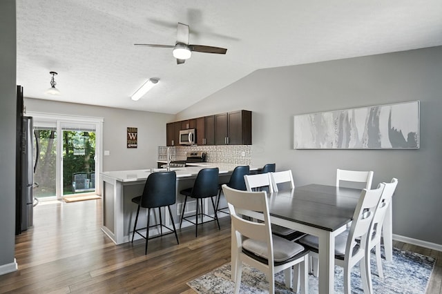 6803 Alex Dr, Canal Winchester, OH 43110 - dining space with dark wood finished floors, a ceiling fan, and lofted ceiling