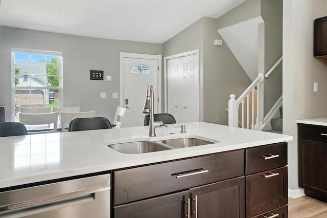 6803 Alex Dr, Canal Winchester, OH 43110 - kitchen with dishwasher, dark brown cabinets, and light stone counters