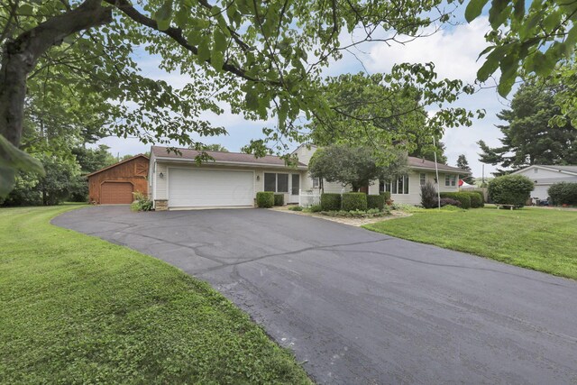 784 Colonial Dr, Heath, OH 43056 - ranch-style home with a front lawn and a garage