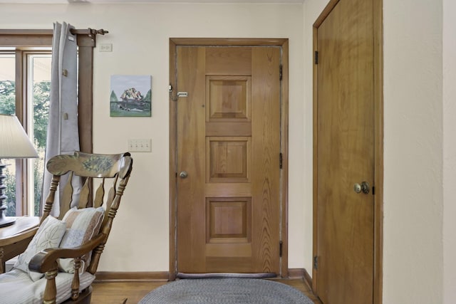 784 Colonial Dr, Heath, OH 43056 - doorway featuring baseboards and wood finished floors