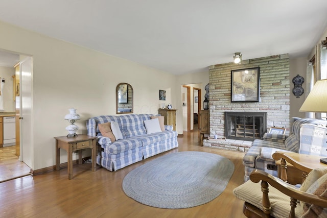 784 Colonial Dr, Heath, OH 43056 - living room featuring a brick fireplace and wood finished floors