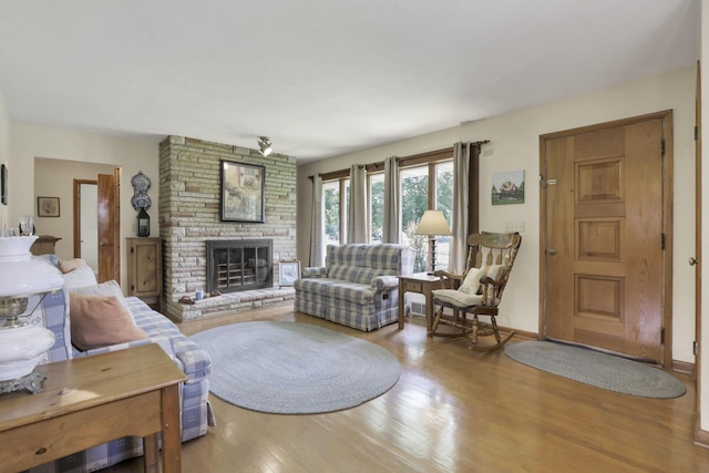 784 Colonial Dr, Heath, OH 43056 - living area featuring a large fireplace and wood finished floors