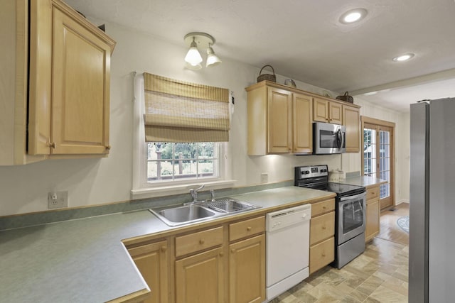 784 Colonial Dr, Heath, OH 43056 - kitchen with appliances with stainless steel finishes, light brown cabinets, healthy amount of natural light, recessed lighting, and light countertops