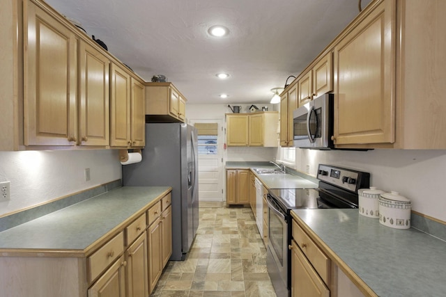 784 Colonial Dr, Heath, OH 43056 - kitchen featuring stainless steel appliances, light brown cabinets, stone finish flooring, and recessed lighting