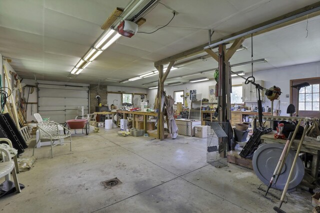 784 Colonial Dr, Heath, OH 43056 - garage with a workshop area and a garage door opener