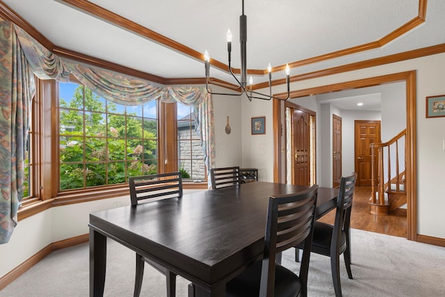 5232 Lola Way, Columbus, OH 43235 - dining area featuring crown molding, light carpet, a chandelier, and stairway