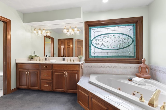 5232 Lola Way, Columbus, OH 43235 - bathroom with double vanity, a whirlpool tub, and a chandelier