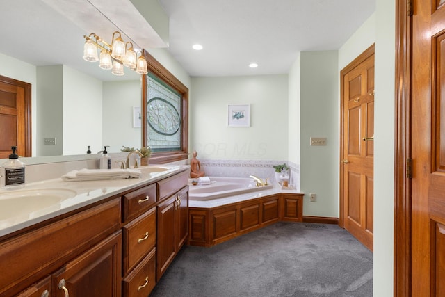 5232 Lola Way, Columbus, OH 43235 - full bath featuring double vanity, a garden tub, recessed lighting, and carpet floors