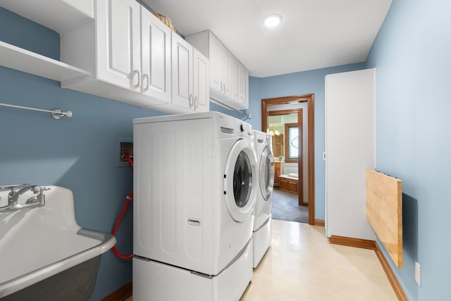 5232 Lola Way, Columbus, OH 43235 - washroom featuring separate washer and dryer, cabinet space, and light floors