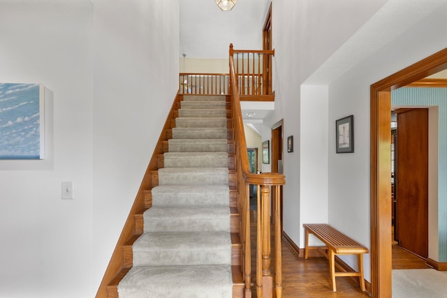 5232 Lola Way, Columbus, OH 43235 - stairs featuring wood finished floors and a high ceiling